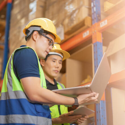 Warehouse workers using software